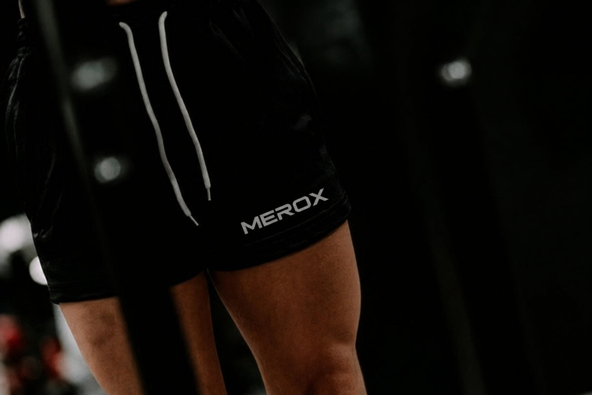 Woman wearing MEROX Solid Black 5-inch mesh shorts
