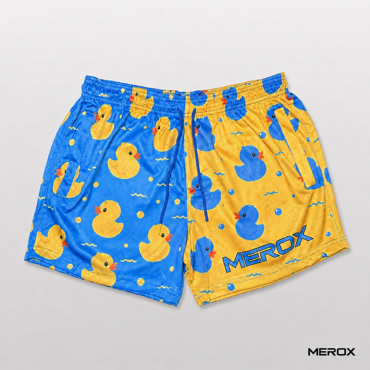 Front view of MEROX blue and yellow rubber duck mesh shorts with adjustable drawstring