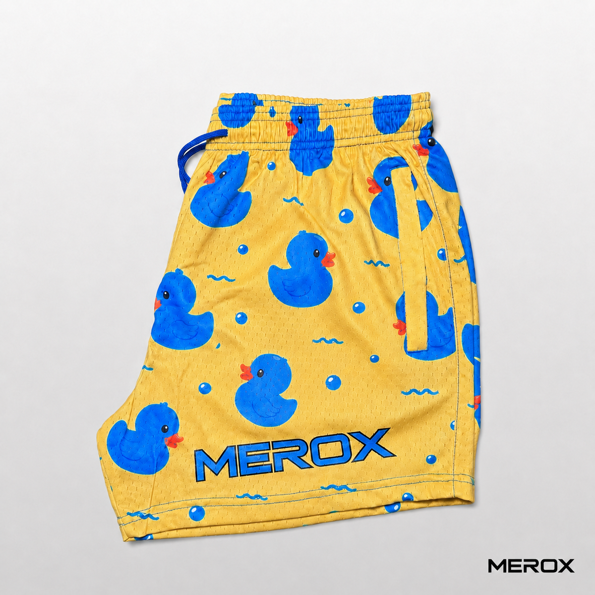 Yellow side of MEROX rubber duck print mesh shorts