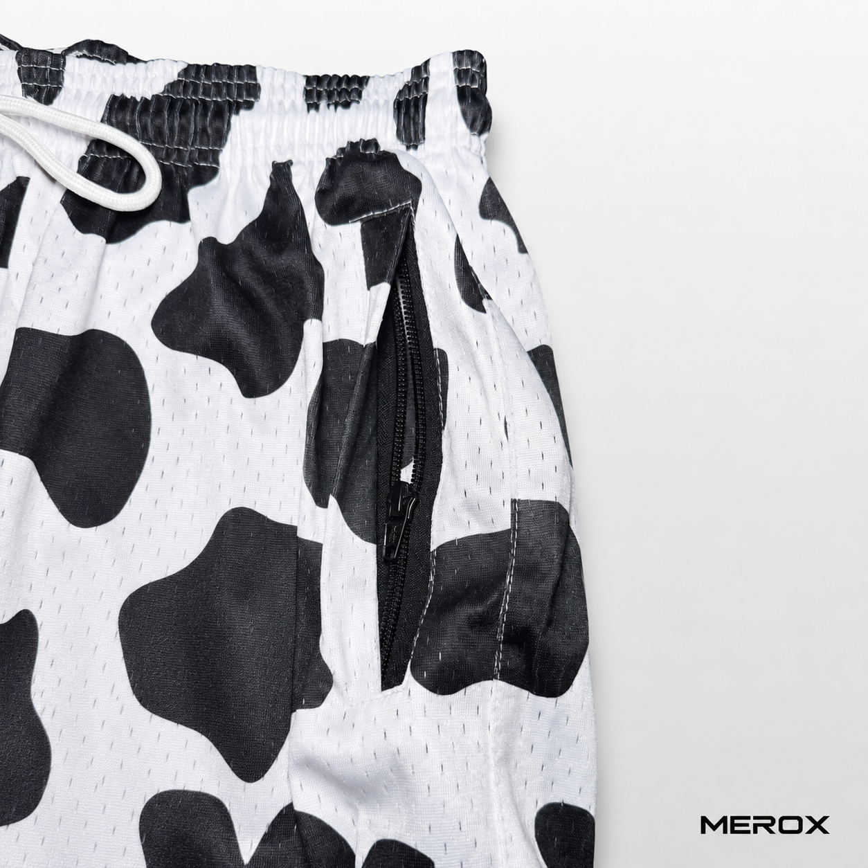MEROX Black and White Cow Print mesh shorts zipper pocket detail