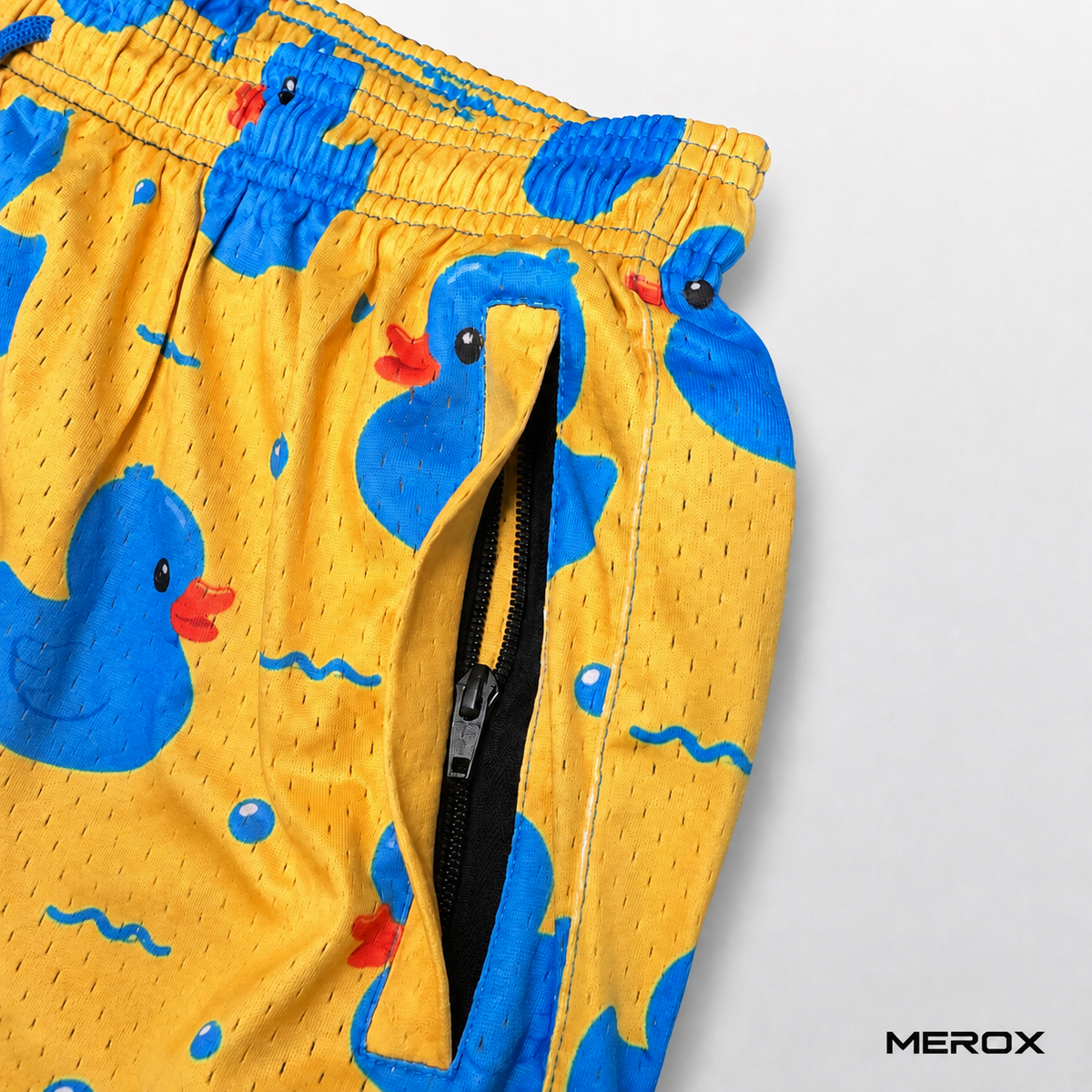 Close-up of the zippered side pocket on MEROX rubber duck mesh shorts