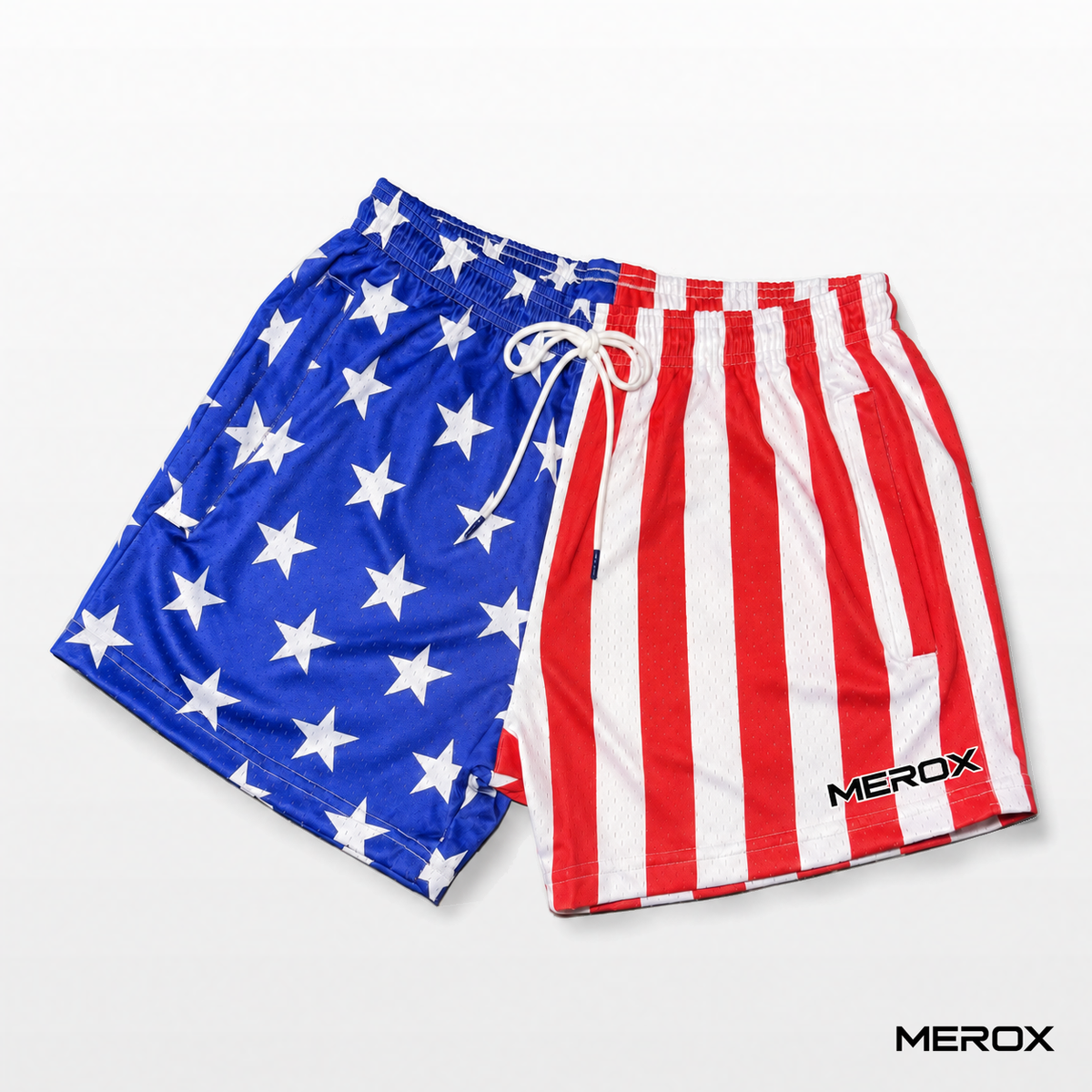 Angled front view of MEROX USA American flag mesh shorts showing the small outer-leg logo, stars and stripes, white drawstring and covered pockets.
