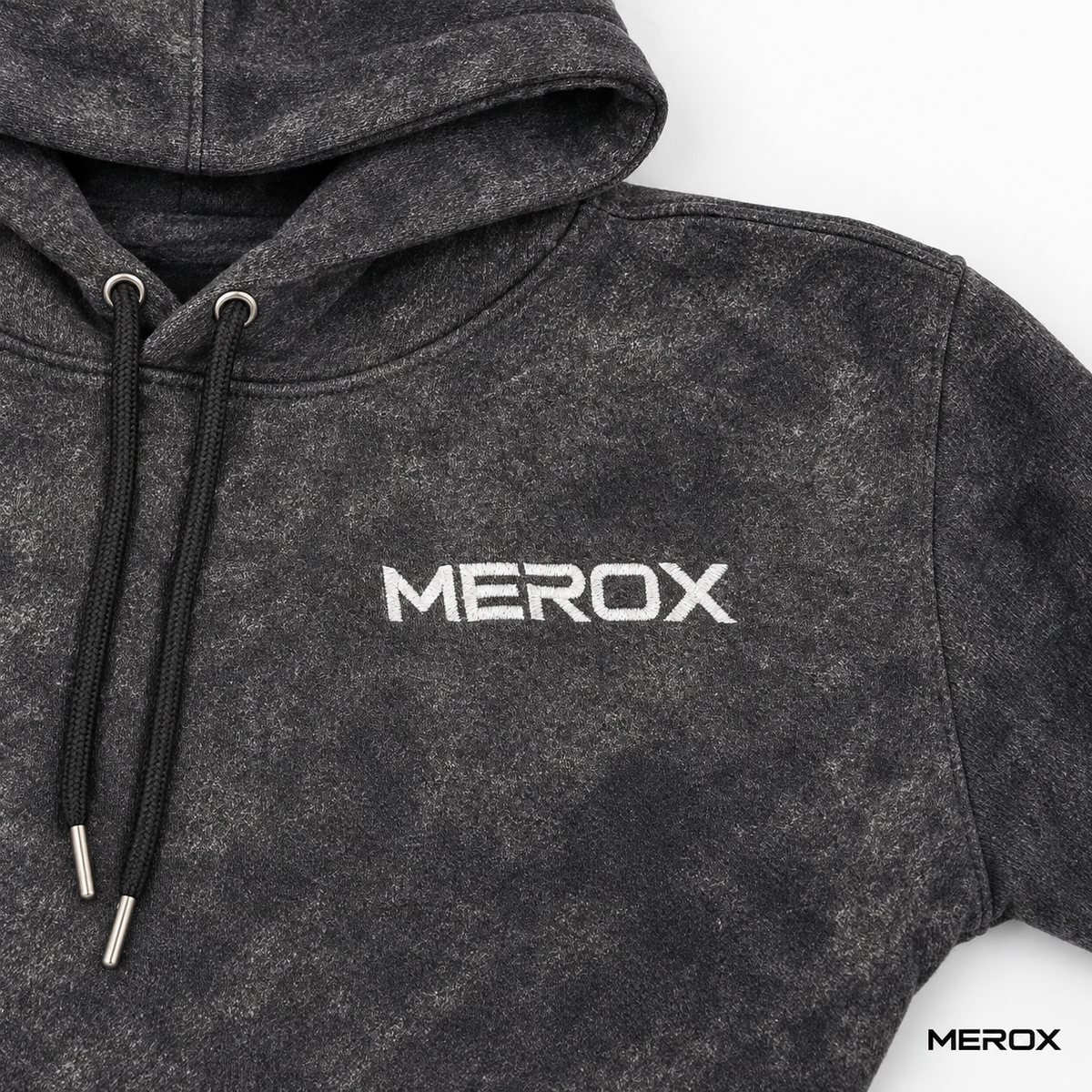 MEROX embroidered logo detail on black acid wash hoodie