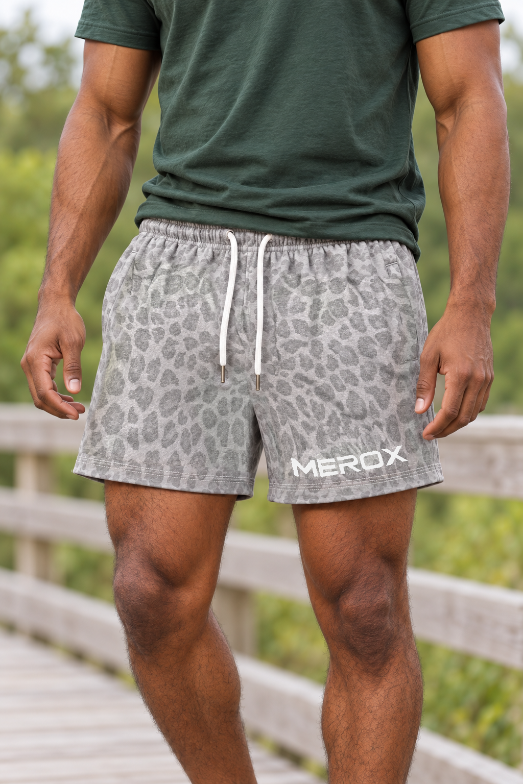 AI-generated adult man wearing MEROX Gray Leopard cotton shorts; product visualization using current garment references