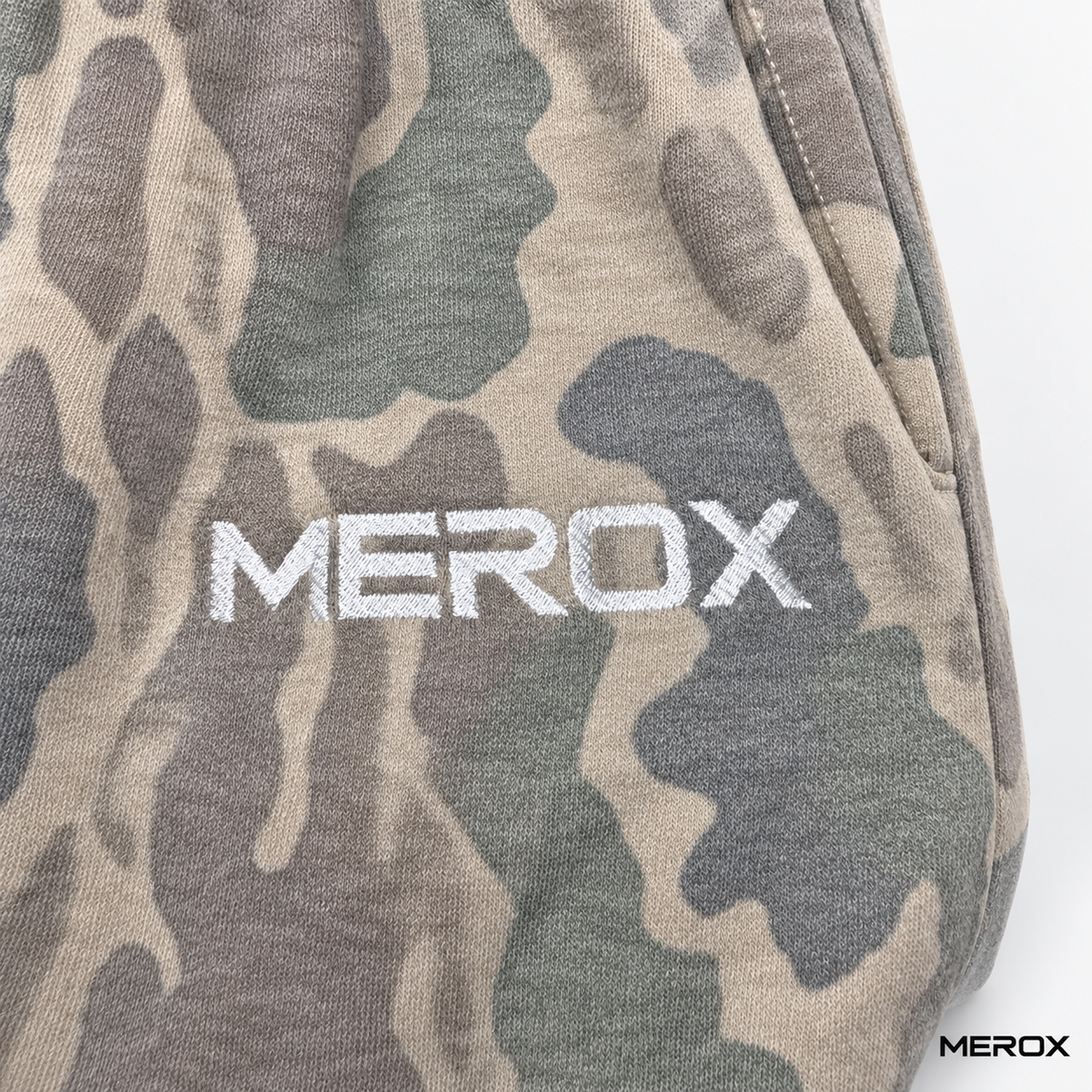 MEROX embroidered logo on Old School washed camo fabric
