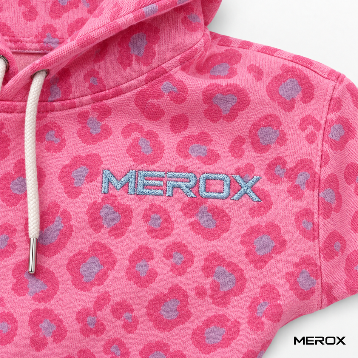 Blue embroidered MEROX chest logo on pink leopard hoodie