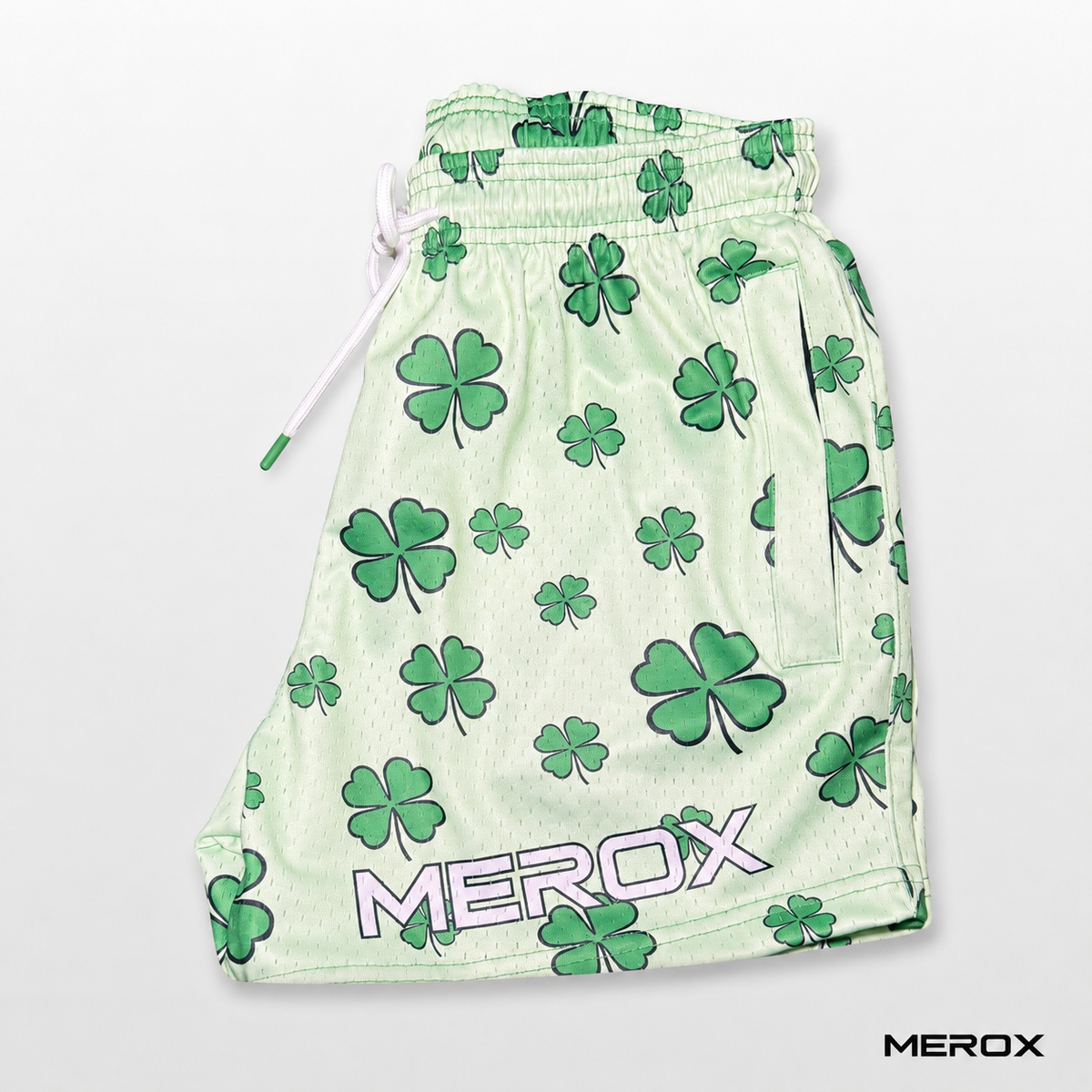 Side view of MEROX St. Patrick’s Day clover mesh shorts with branded leg