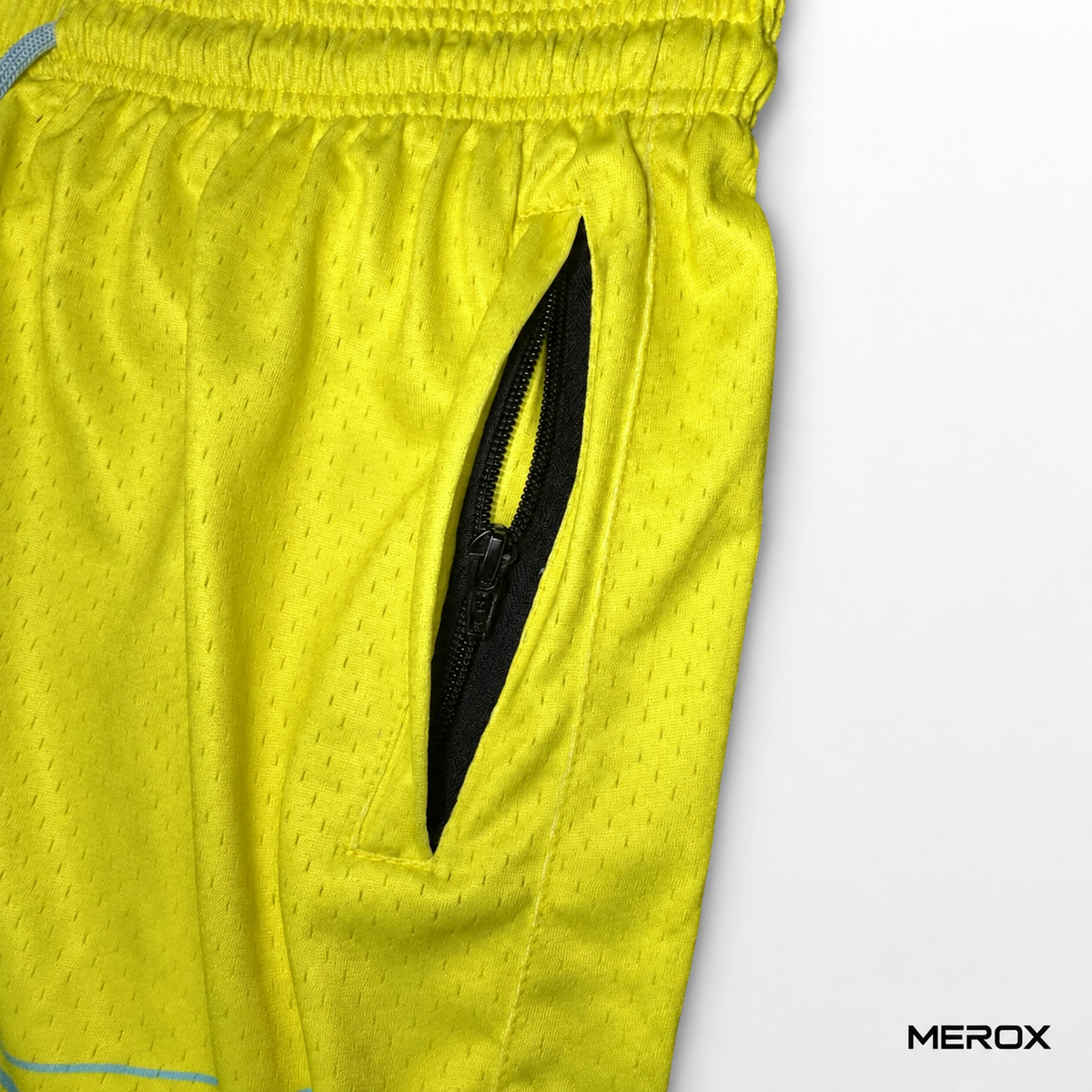 MEROX solid yellow mesh shorts zipper pocket detail