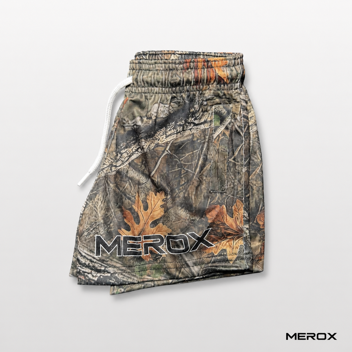 MEROX Youth woodland camo mesh shorts side view with zipper pocket